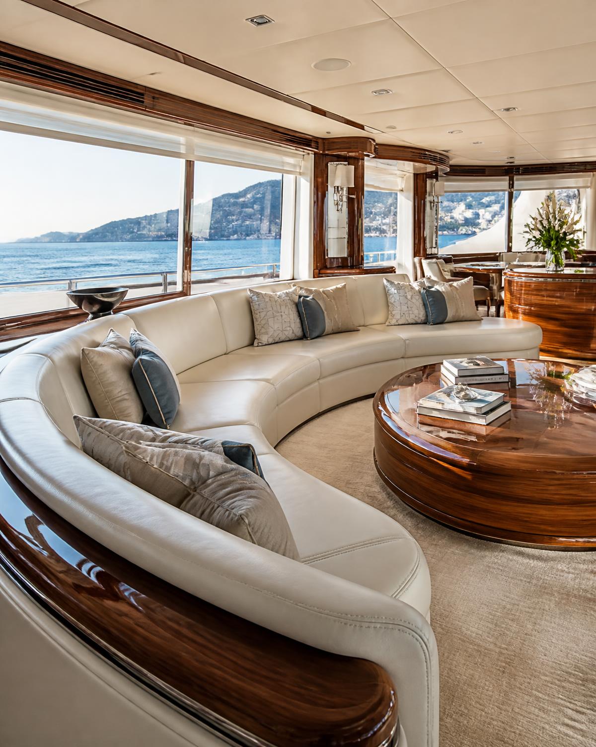 Luxury yacht interior with cream curved seating